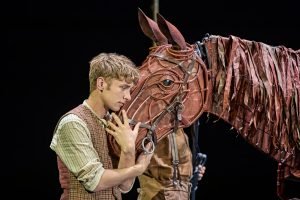 Tom Sturgess as Albert Narracott and Joey the horse (Photo: Brinkhoff Moegenburg)